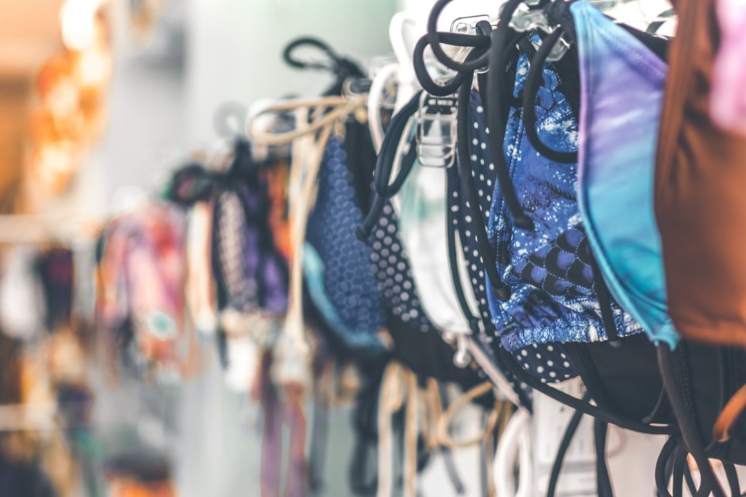 a row of bras hanging on a wall cowinaudio