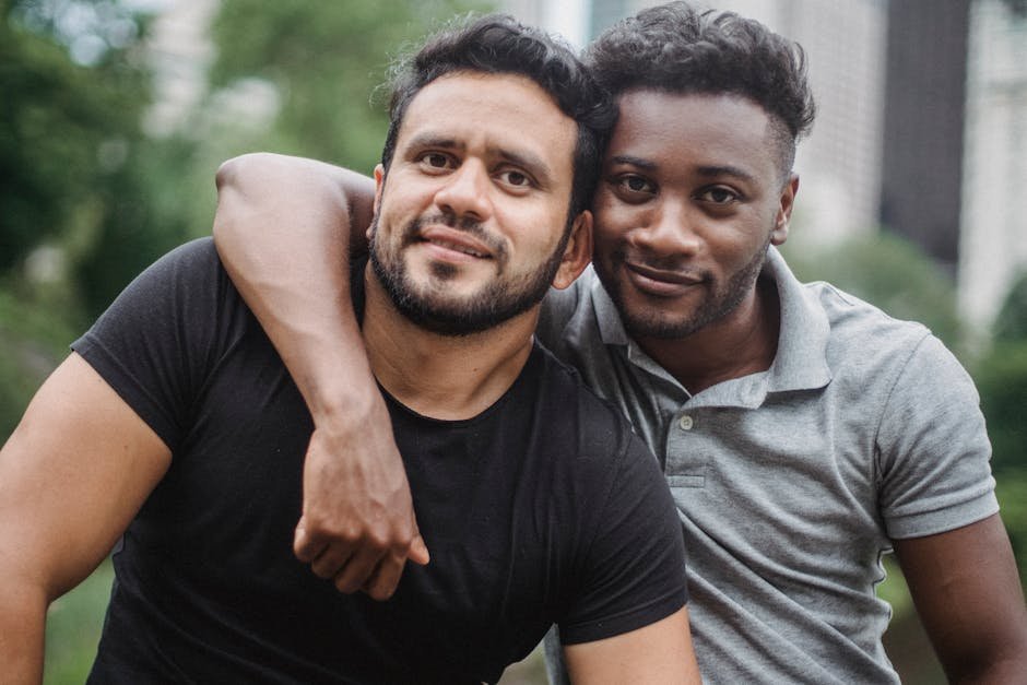 Portrait of Happy Men Hugging